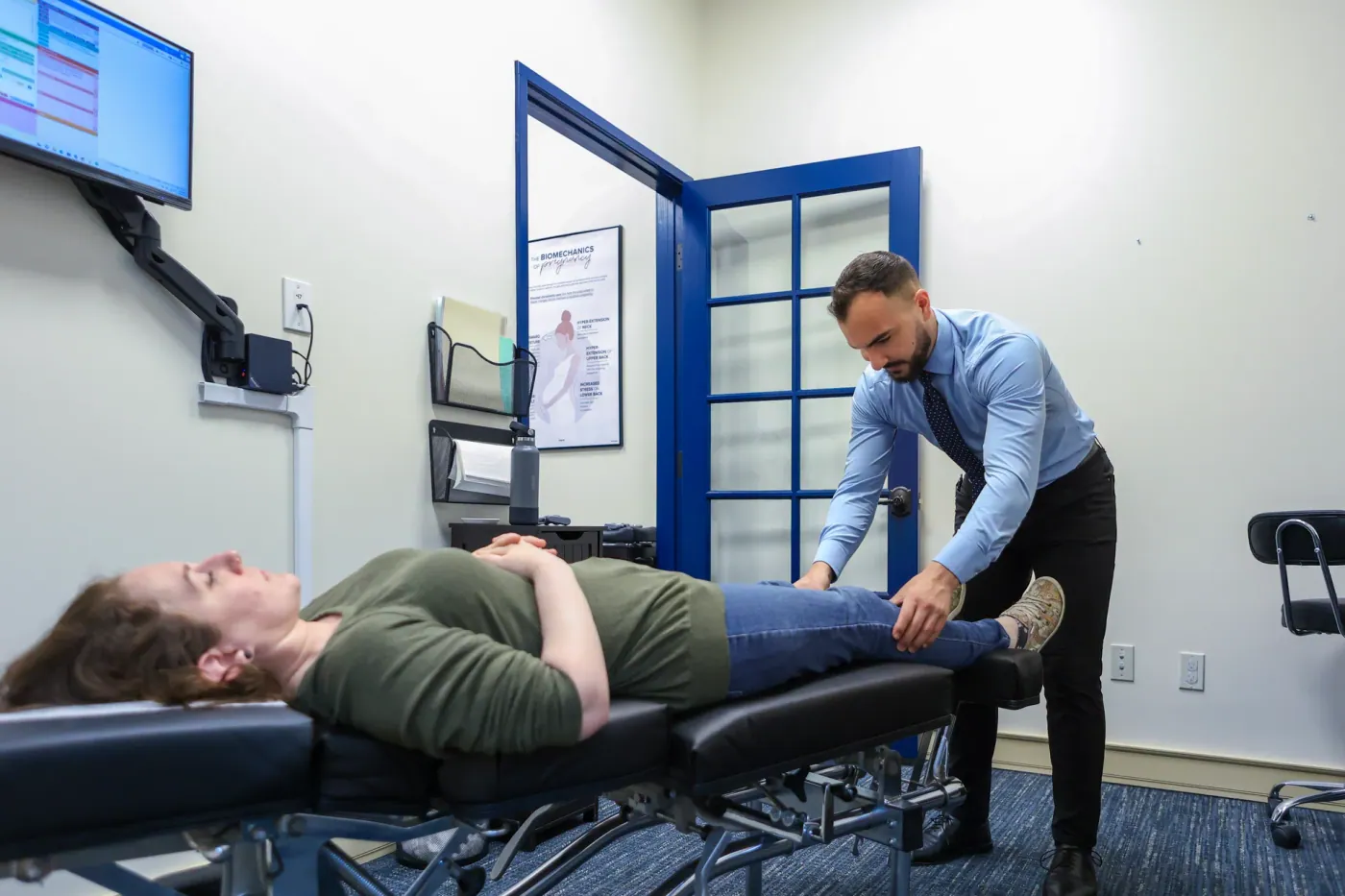 Chiropractor providing leg pain relief with a spinal adjustment in San Luis Obispo, CA