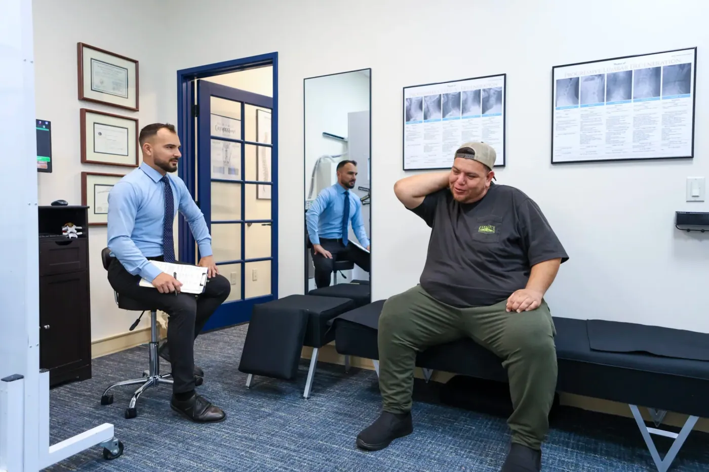 Dr. David Sedghi working with male patient